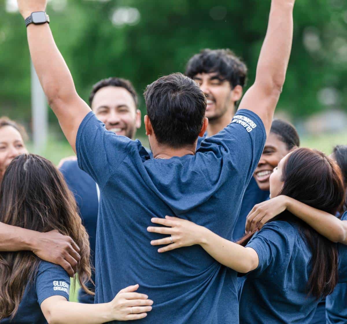 Team of young people celebrate together